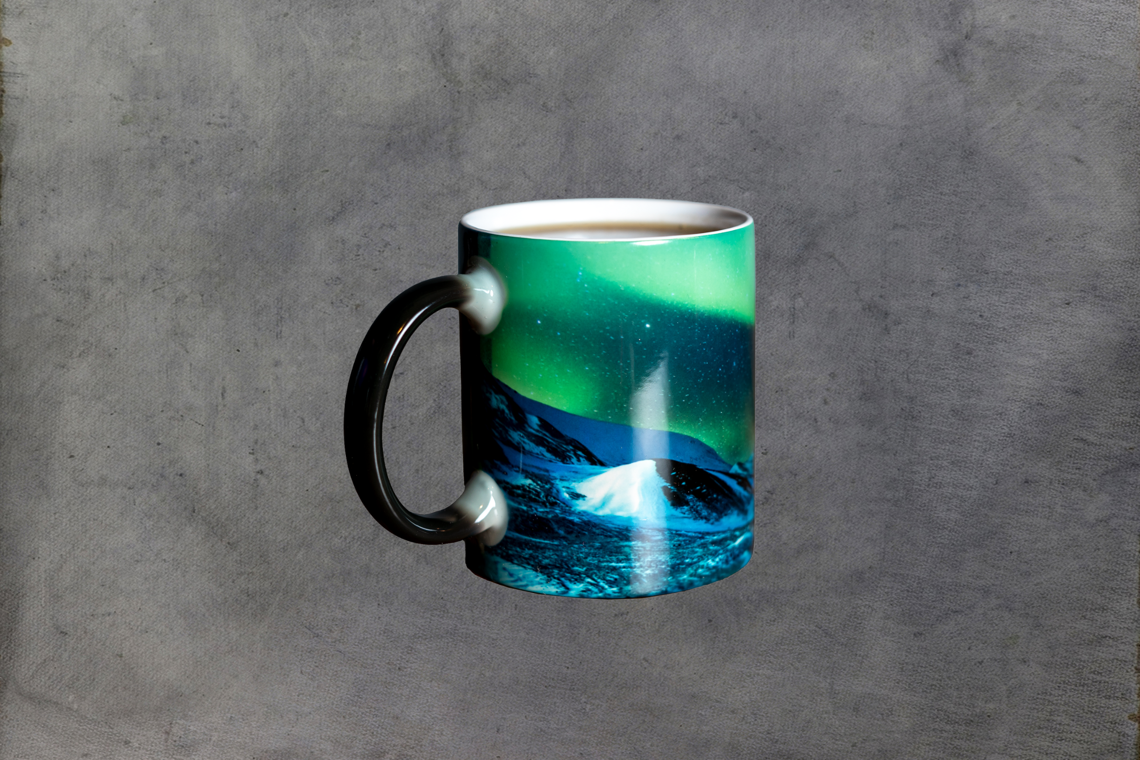 Chena Hot Springs Resort mug with green and blue aurora over a snowy mountain landscape.